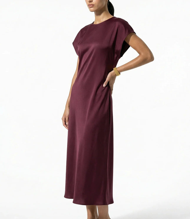 Side view of burgundy satin midi dress with midi length and soft drape