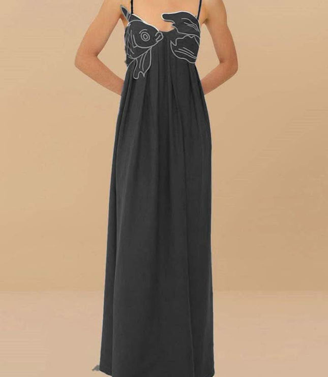 Black fish print maxi dress shown from the back with thin straps and long drape