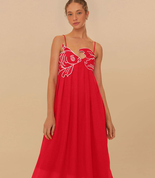 Front view of red fish print maxi dress with V neckline and relaxed summer style
