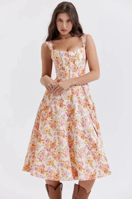 Floral midi dress with square neckline and wide straps, shown front view for wedding guest wear
