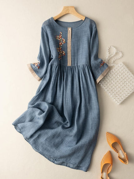Blue women's summer embroidered midi dress with gathered waist and floral sleeve accents