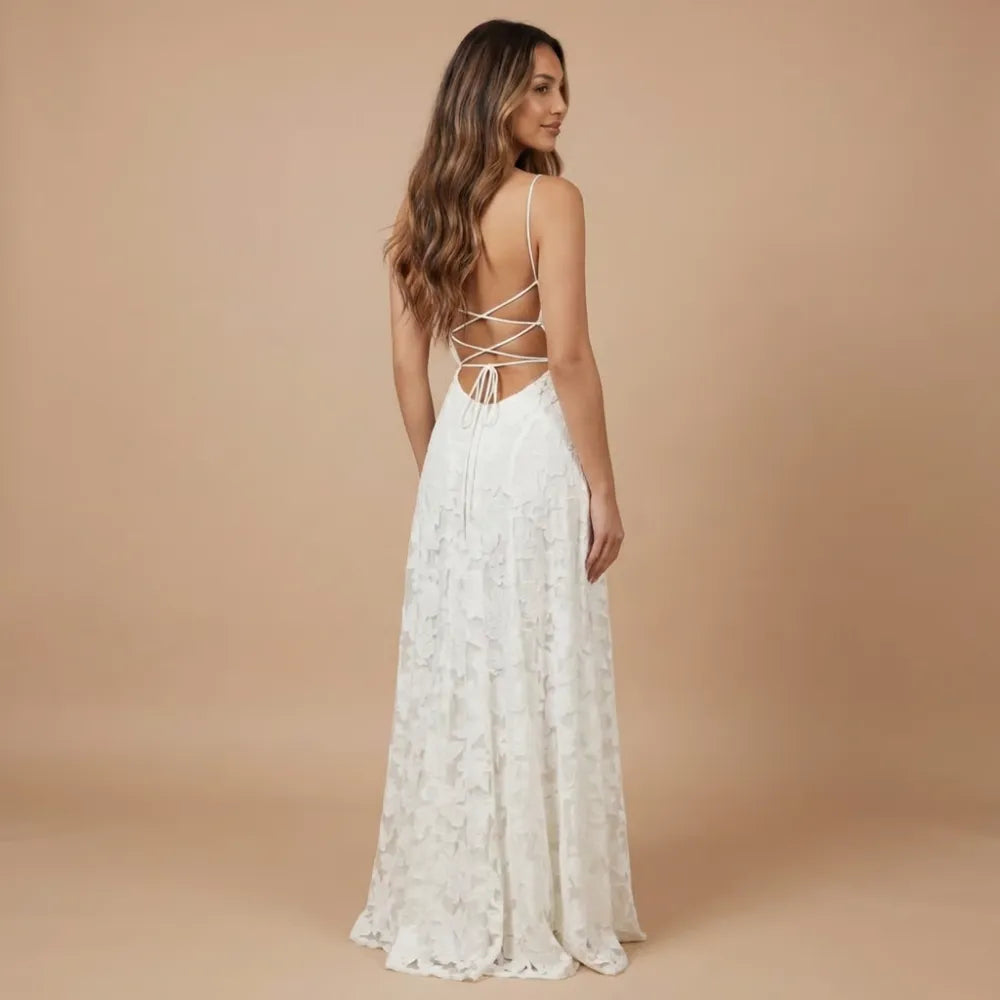 Back view of ivory lace maxi dress with crisscross lace-up back detail