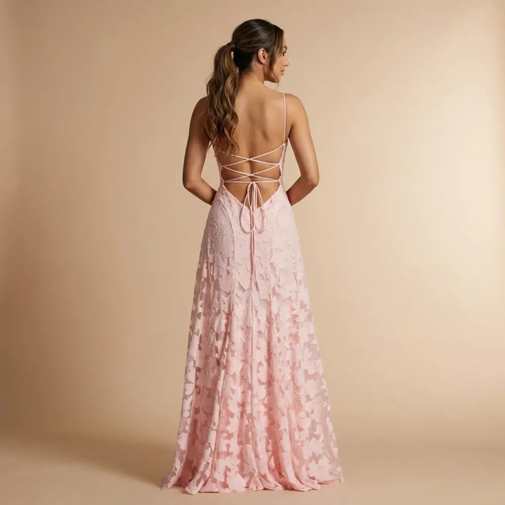 Back view of pink lace maxi dress with crisscross lace-up back