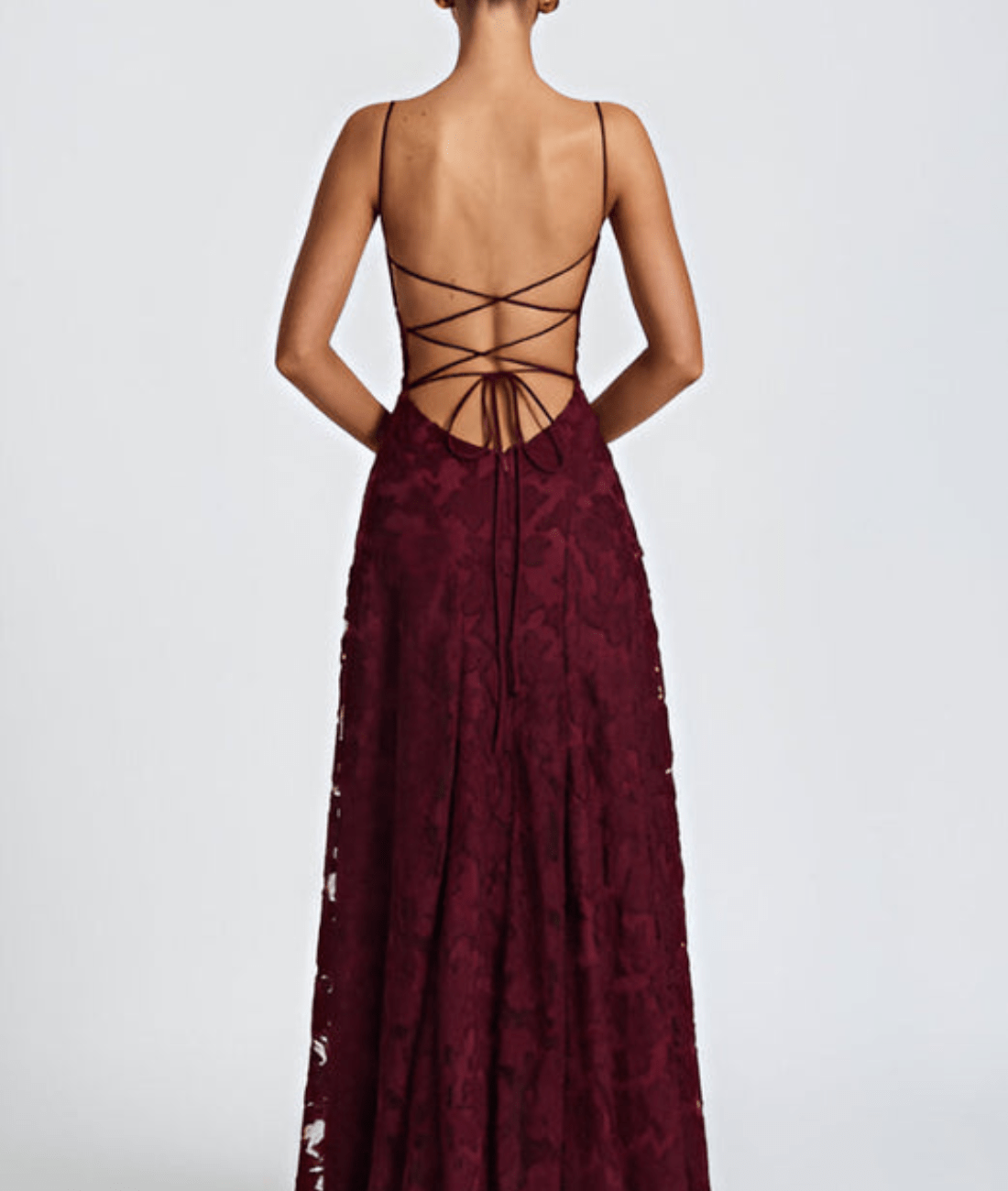 Back view of burgundy floral maxi dress with open back and crisscross tie straps