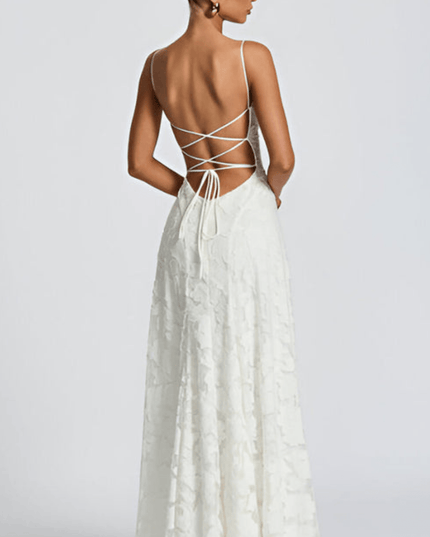 Back view of white floral maxi dress with open back and crisscross tie detail