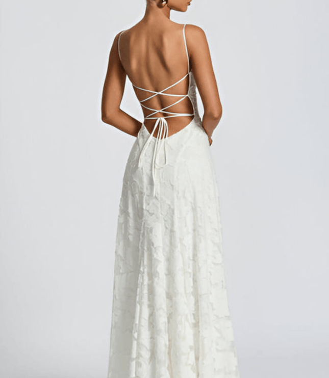Back view of white floral maxi dress with open back and crisscross tie detail
