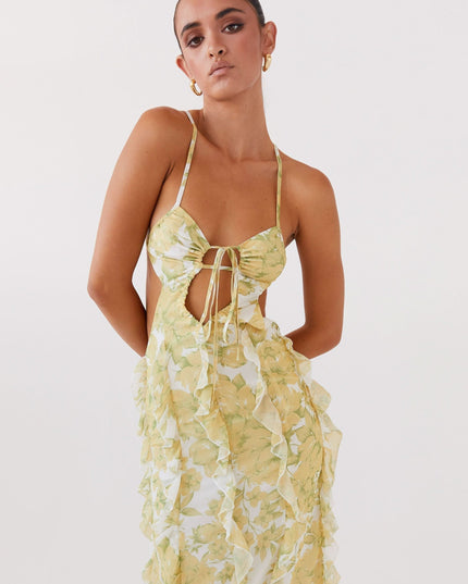 Close-up of floral maxi dress bodice with tie front, cutout detail, and delicate spaghetti straps