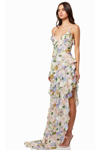 Side view of a floral wedding guest maxi dress with V neck, thin straps, and high slit