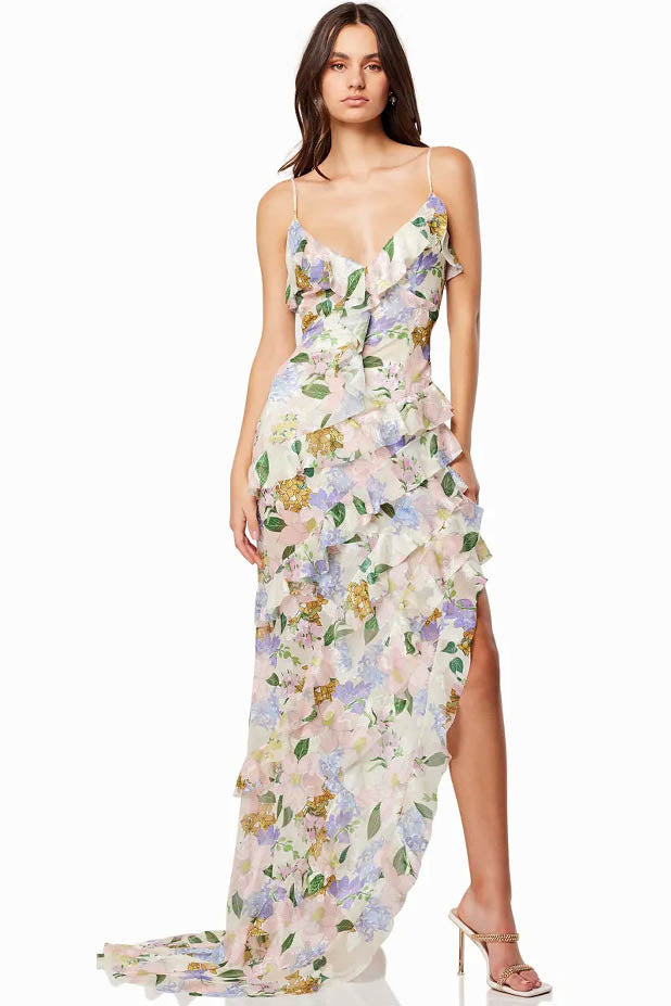 Full length floral maxi dress with V neckline, asymmetrical ruffles, and side slit