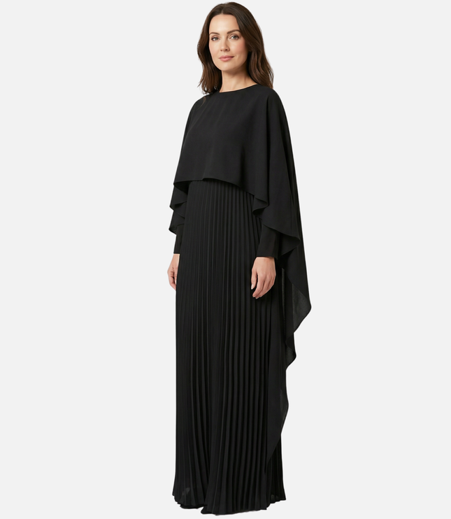 Front view of black cape overlay maxi dress with long pleated skirt for formal wear