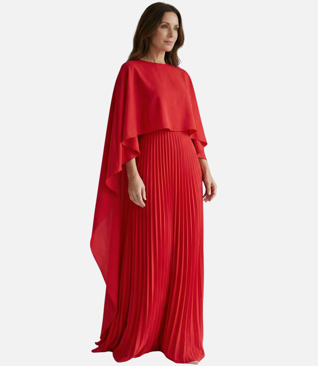 Side view of red formal maxi dress with flowing cape overlay and pleated skirt