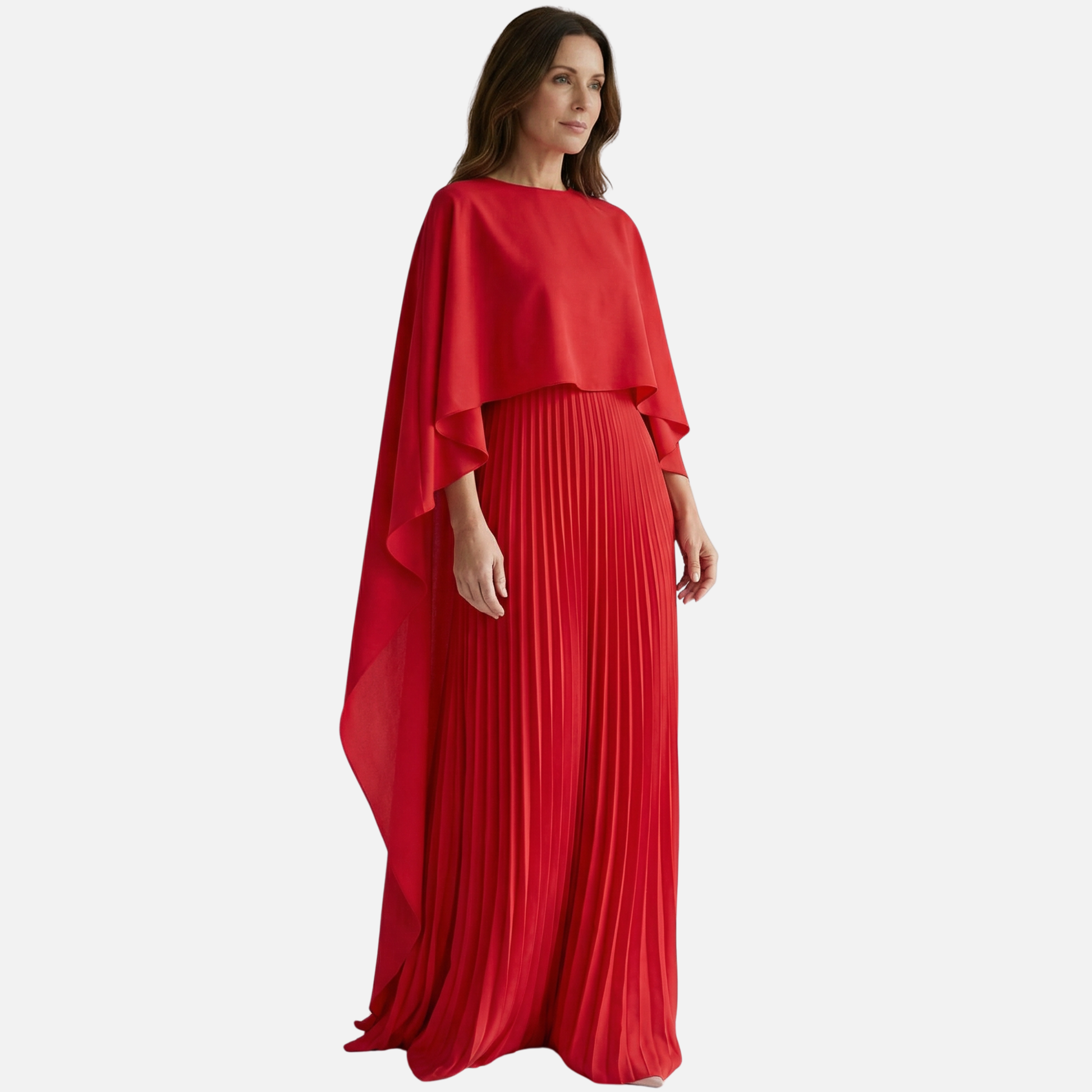 Side view of red formal maxi dress with flowing cape overlay and pleated skirt