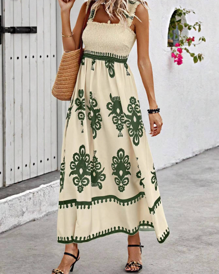 Cream floral summer dress with green border print, sleeveless smocked top and flowy maxi skirt