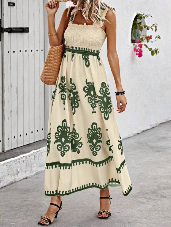 Cream floral summer dress with green border print, sleeveless smocked top and flowy maxi skirt