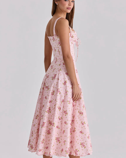 Side view of pink floral midi dress with sweetheart neckline and fitted waist