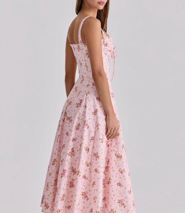 Side view of pink floral midi dress with sweetheart neckline and fitted waist