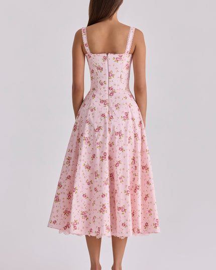 Back view of pink floral wedding guest midi dress with lace straps and full skirt