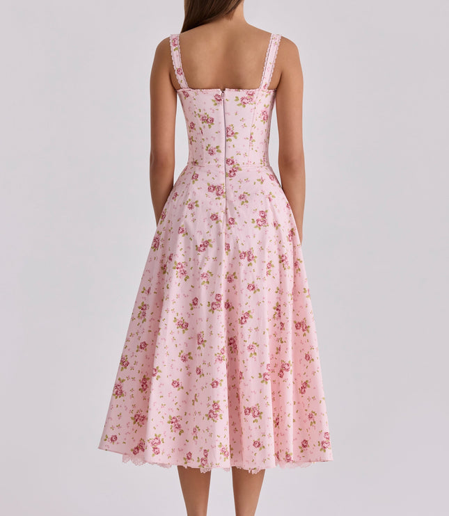 Back view of pink floral wedding guest midi dress with lace straps and full skirt