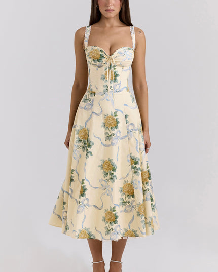 Side view of cream floral wedding guest dress with corset bodice and midi length skirt