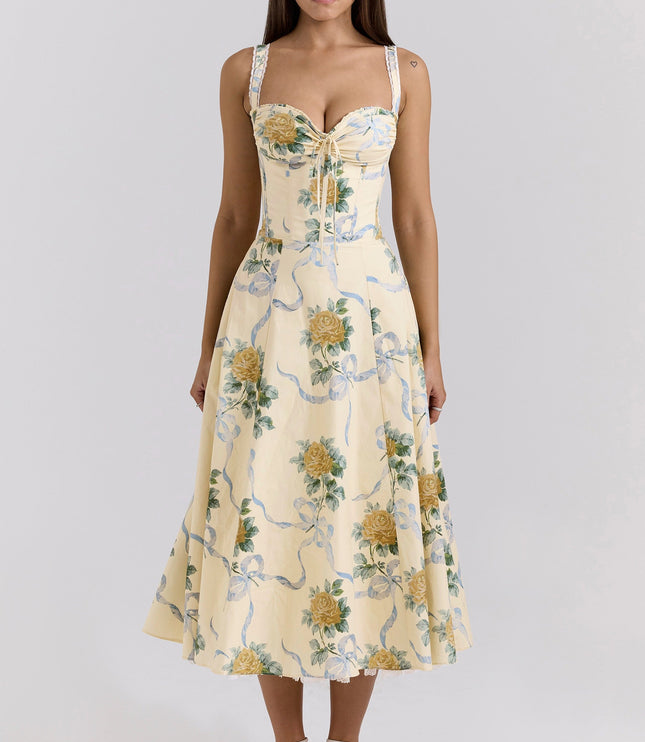 Side view of cream floral wedding guest dress with corset bodice and midi length skirt