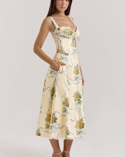 Back view of cream floral midi dress with lace straps, zipper closure, and full skirt