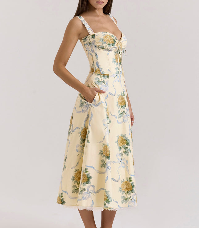 Back view of cream floral midi dress with lace straps, zipper closure, and full skirt