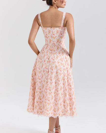 Floral midi dress shown with gathered skirt lifted to reveal lace trim and layered hem detail
