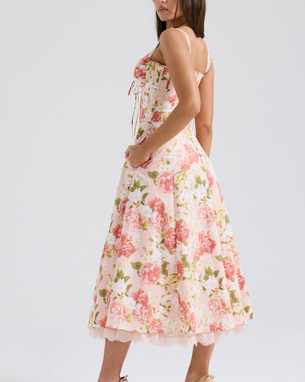 Front view of bold floral midi dress with sweetheart neckline, fitted waist, and side pockets