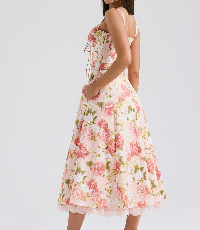 Front view of bold floral midi dress with sweetheart neckline, fitted waist, and side pockets