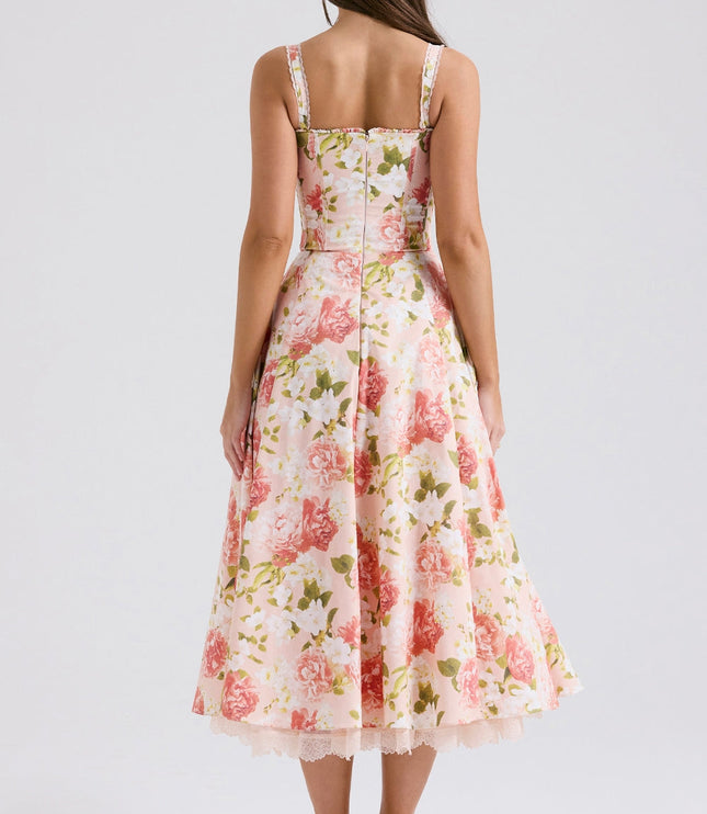 Side view of floral wedding guest midi dress with corset-style bodice and full skirt