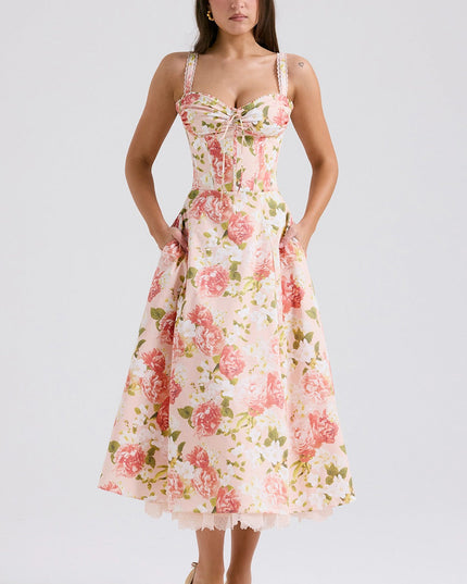 Back view of floral midi dress with fitted bodice, flared skirt, and lace hem peeking out