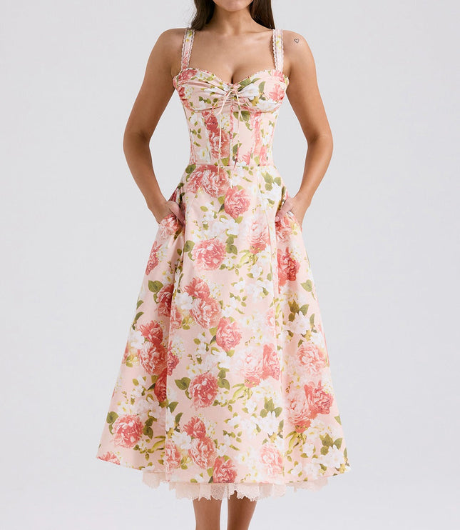 Back view of floral midi dress with fitted bodice, flared skirt, and lace hem peeking out