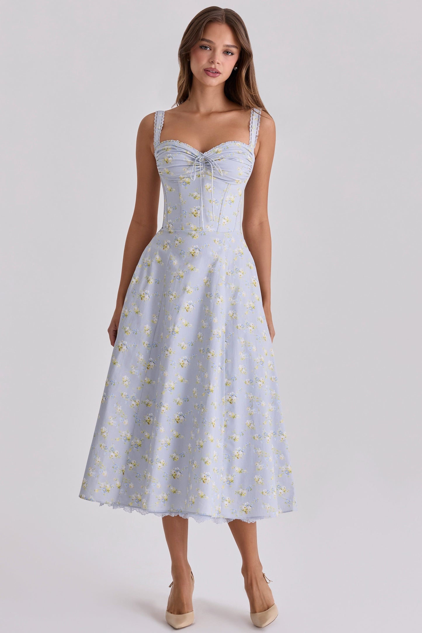 Side view of light blue floral midi dress with sweetheart neckline and corset seams