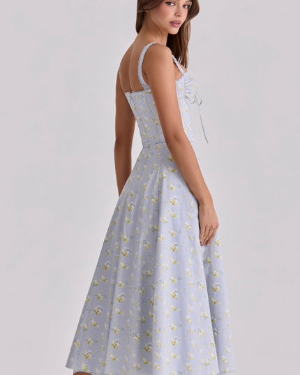 Back view of light blue floral wedding guest dress with fitted bodice and midi hem
