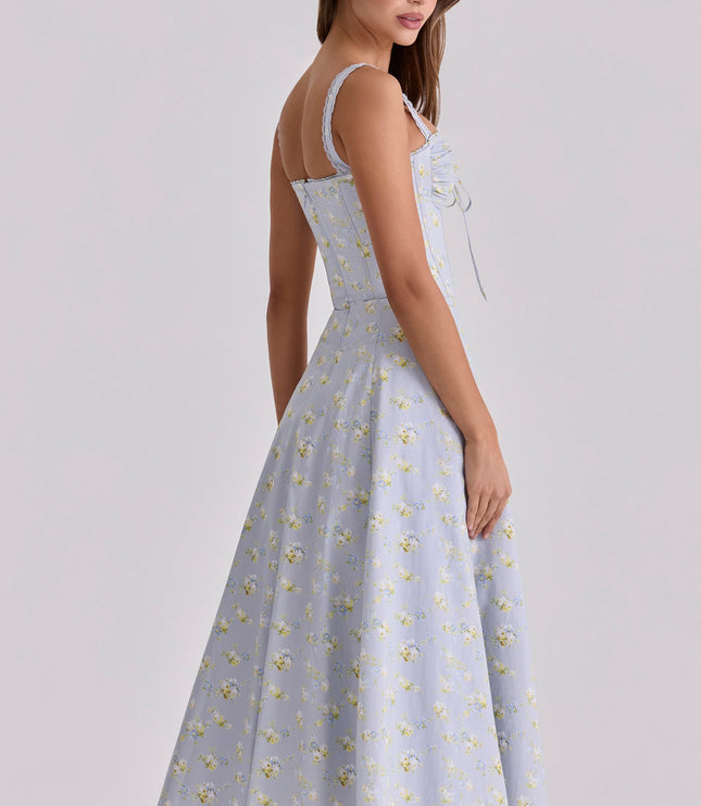Back view of light blue floral wedding guest dress with fitted bodice and midi hem
