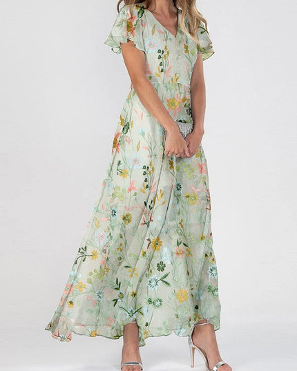 Women's summer floral V neck maxi dress in light green with flutter sleeves and flowing skirt