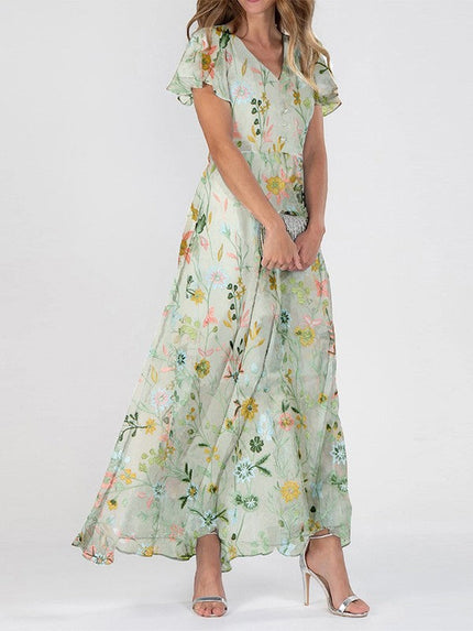 Women's summer floral V neck maxi dress in light green with flutter sleeves and flowing skirt