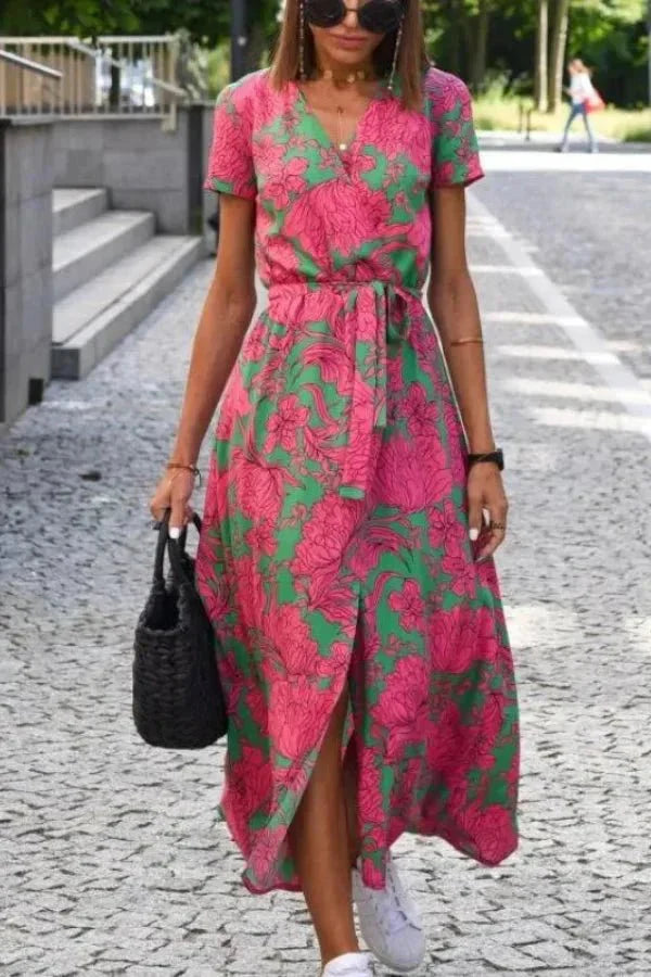 Front view of summer floral midi dress with V neck, tie waist, and front slit detail
