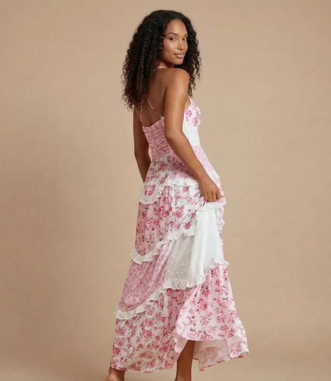 Back view of pink floral maxi dress showing open back and layered ruffled hem detail