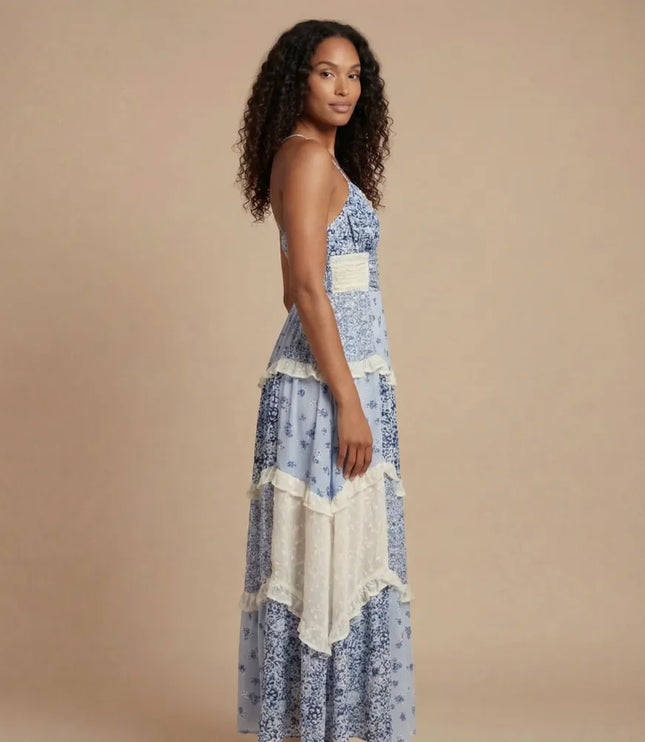 Blue floral v-neck maxi dress with cream waistband and asymmetrical tiered ruffle layers