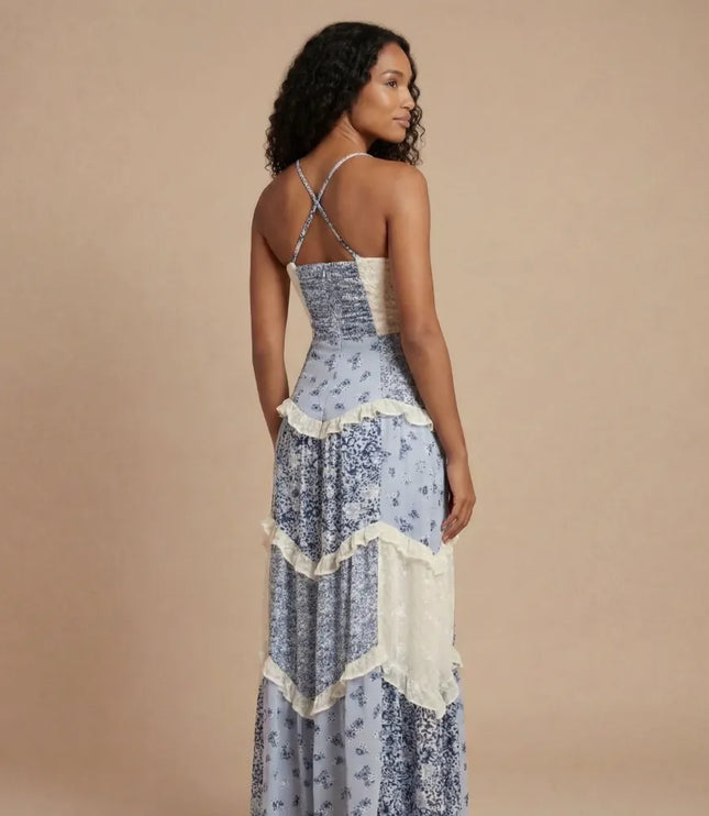 Back view of blue floral maxi dress with crisscross straps and cream ruffled tier details