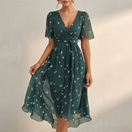 Green floral V neck mini dress with wrap front, short sleeves, and airy hem
