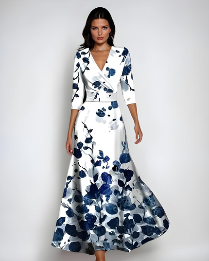 White floral maxi dress with V neck, three quarter sleeves, and navy blossom print