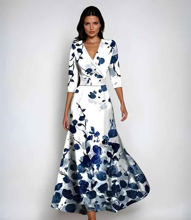 White floral maxi dress with V neck, three quarter sleeves, and navy blossom print