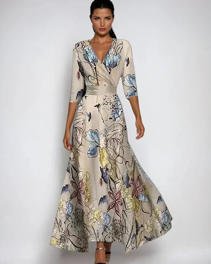 Beige floral maxi dress with V neck, three quarter sleeves, and flowing skirt
