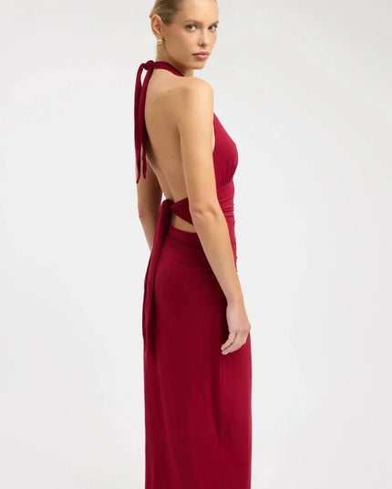 Back view of burgundy formal maxi halter dress with open back and tie straps