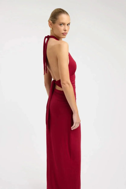 Back view of burgundy formal maxi halter dress with open back and tie straps