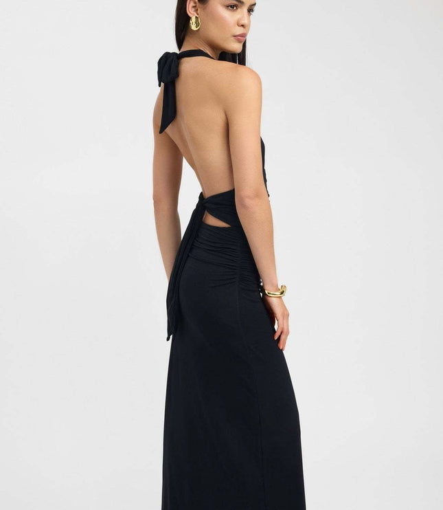 Front view of pale yellow halter maxi dress with deep V neckline and ruched waist
