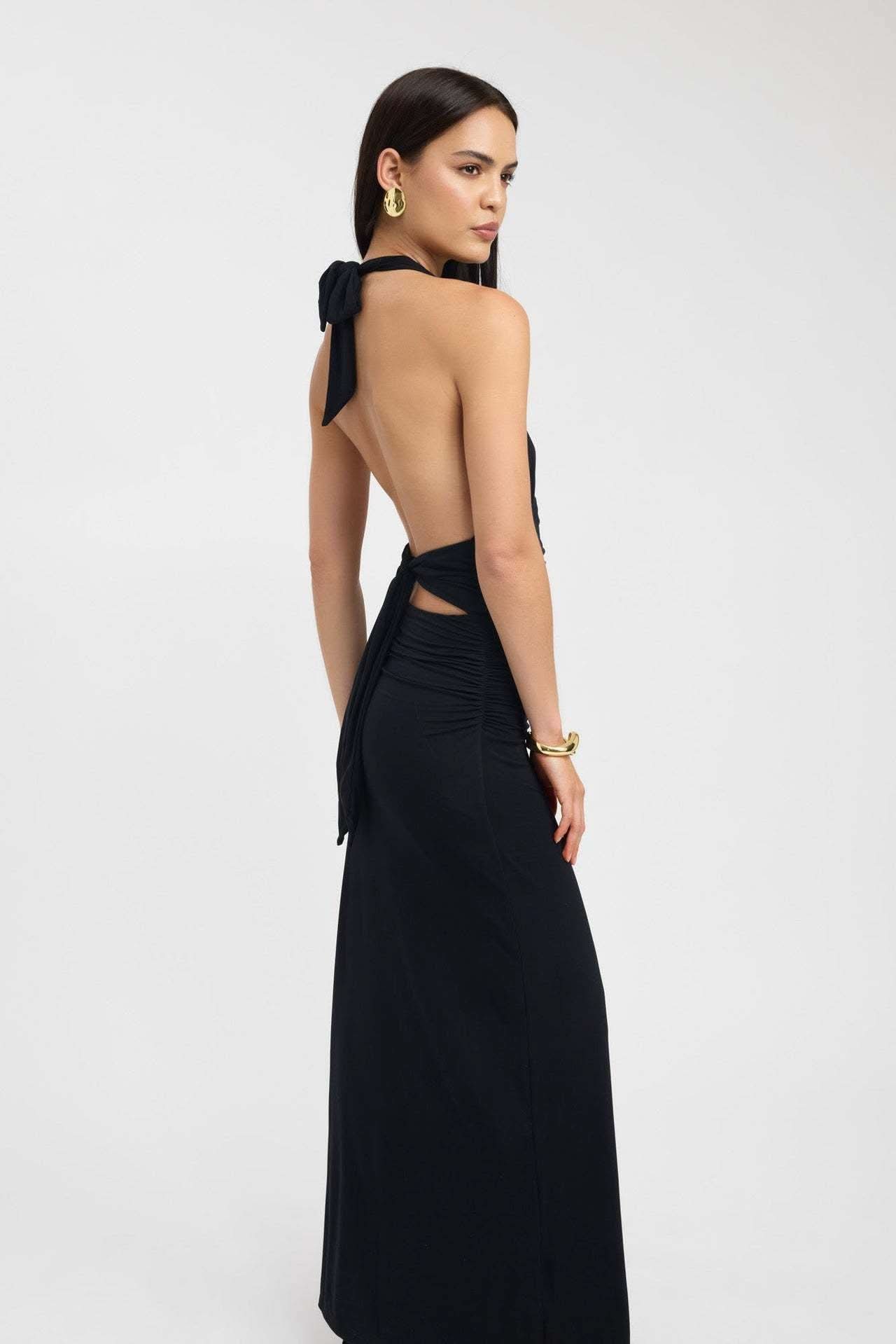 Front view of pale yellow halter maxi dress with deep V neckline and ruched waist