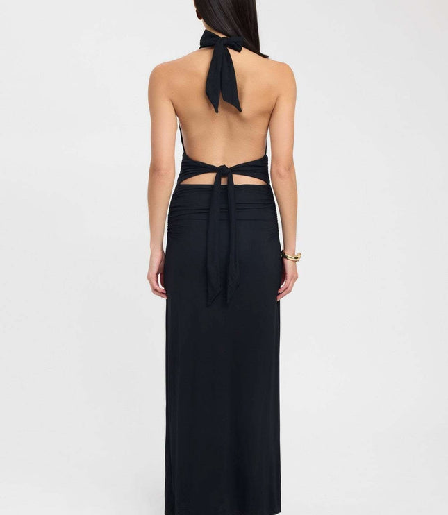 Side view of a pale yellow formal maxi dress with low open back and ruched hip detail